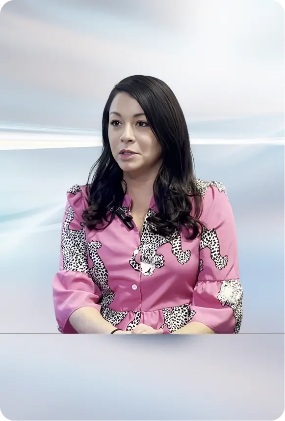 Jennifer Garrott speaking with a microphone attached to her suit