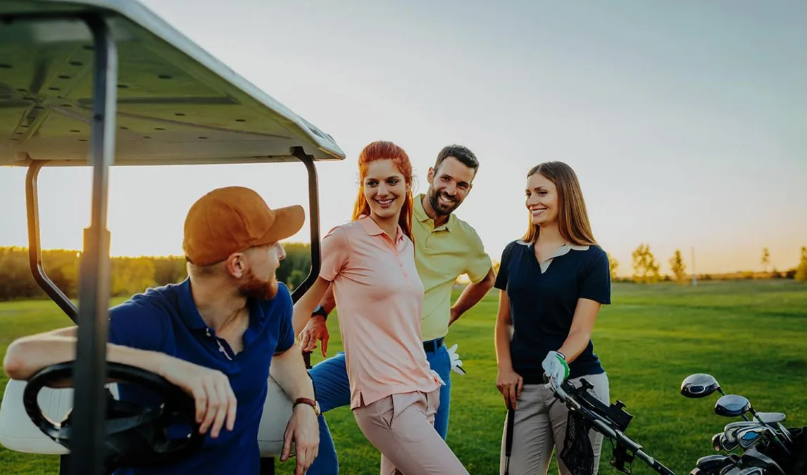 Male and female golfers on a golf course